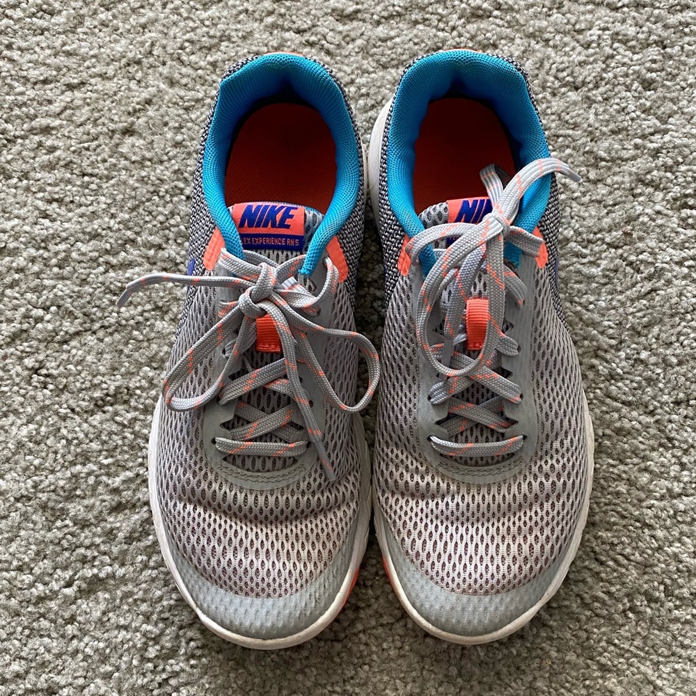 Gray and Blue Nike shoes